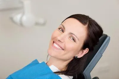 woman smiling during her oral surgery appointment at DentaCare Dental Group Longview