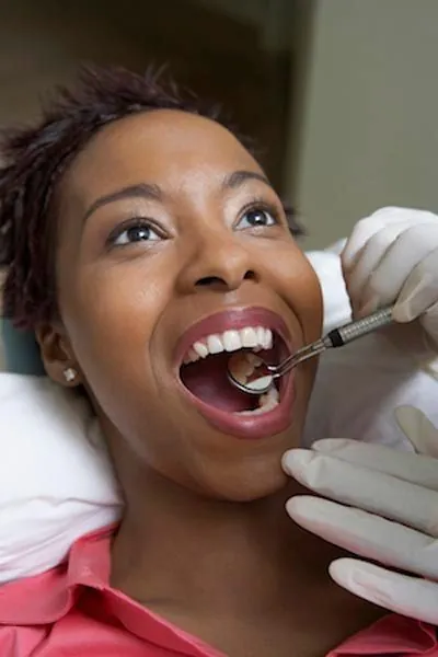 woman getting preventive dentistry in Longview, TX